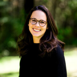 Elizabeth O'Connell 2024 Headshot Elizabeth O'Connell standing in front of a green background