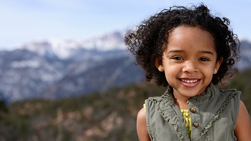 CO Girl Smiling mountains