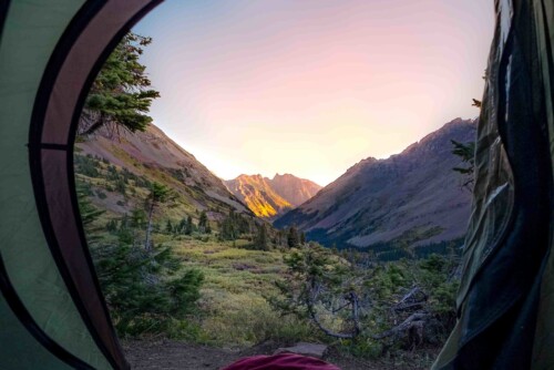 hiker relaxing in tent