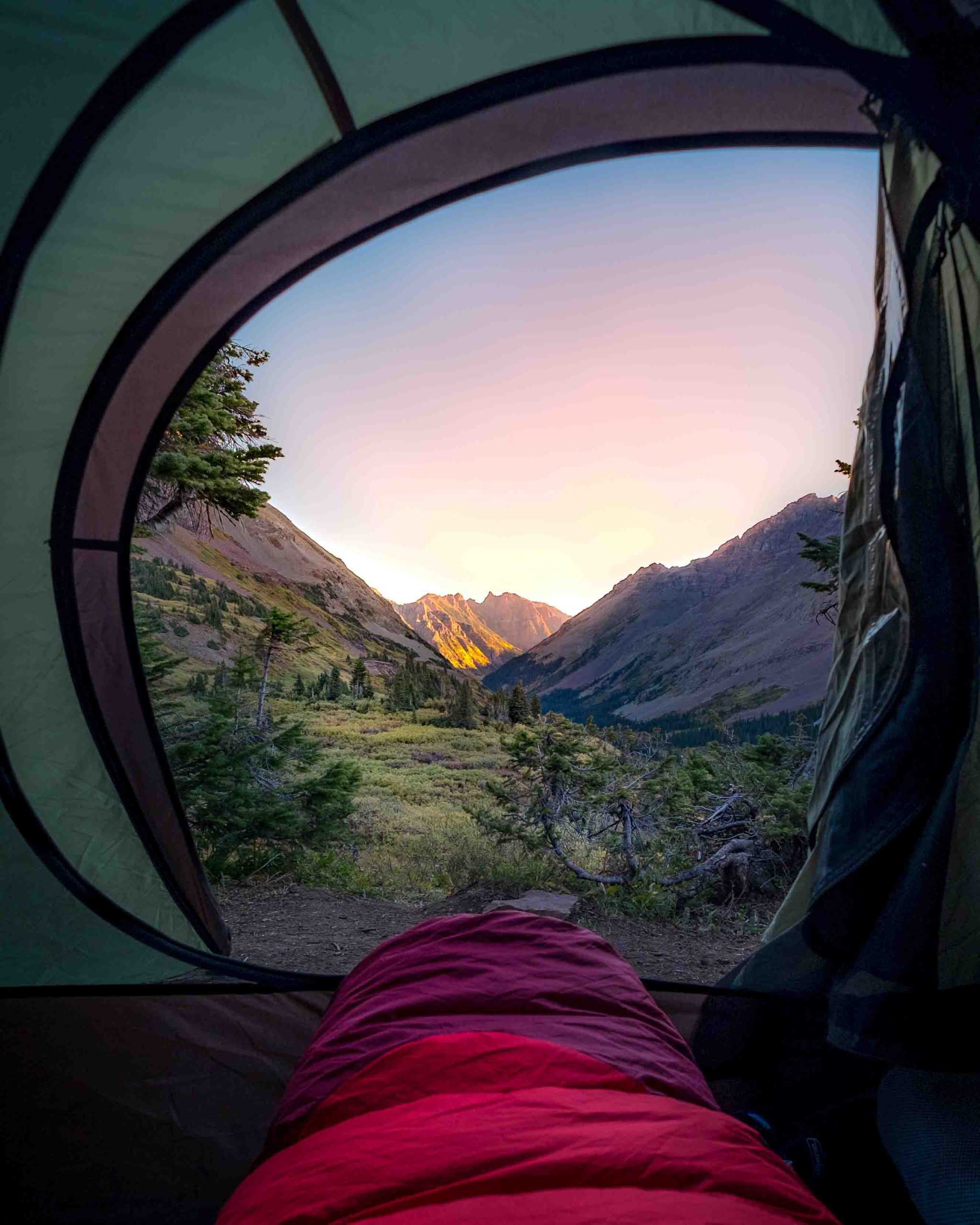 hiker relaxing in tent