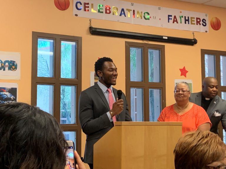 Jermareon Williams speaking at a community event.