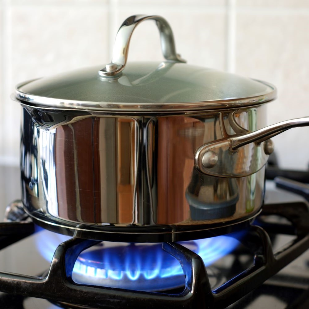 gas stove with pot burning
