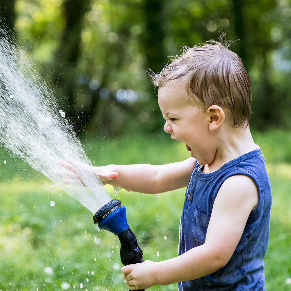 child with hose