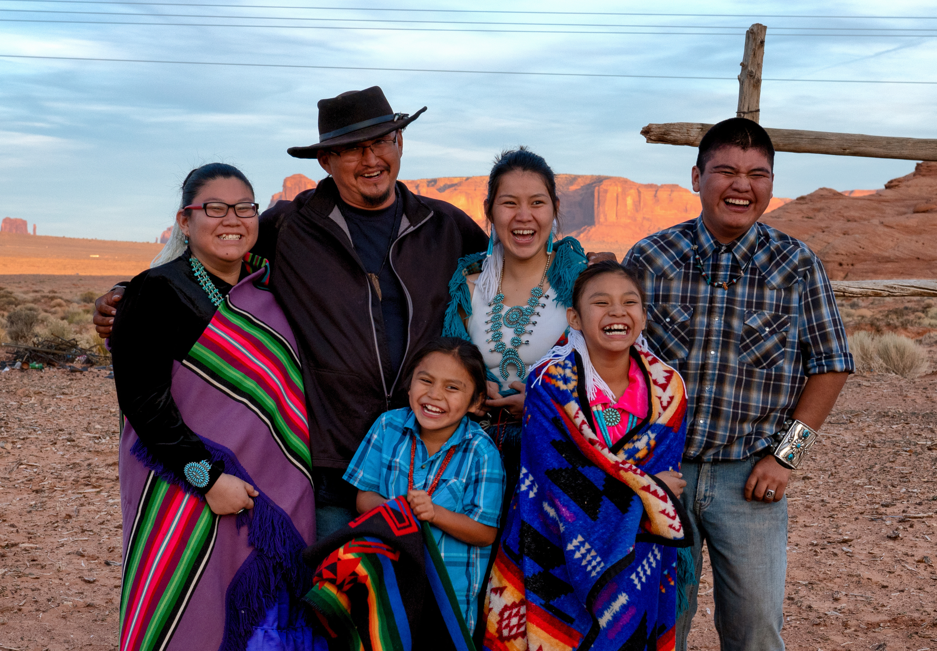 Happy Navajo family laughing together at their land in Monument Valley Arizona.