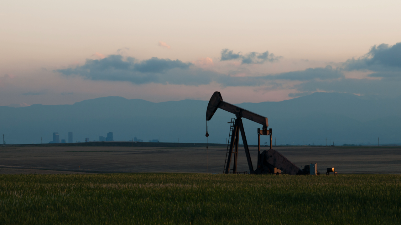 A pump jack silhouetted against the skyline in Colorado.