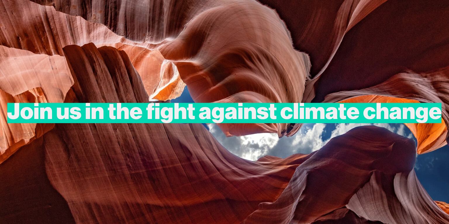 Untitled A wave-like rock formation with sunlight filtering through, highlighting orange and brown tones. Text overlay reads: "Join us in the fight against climate change" in bold turquoise font.