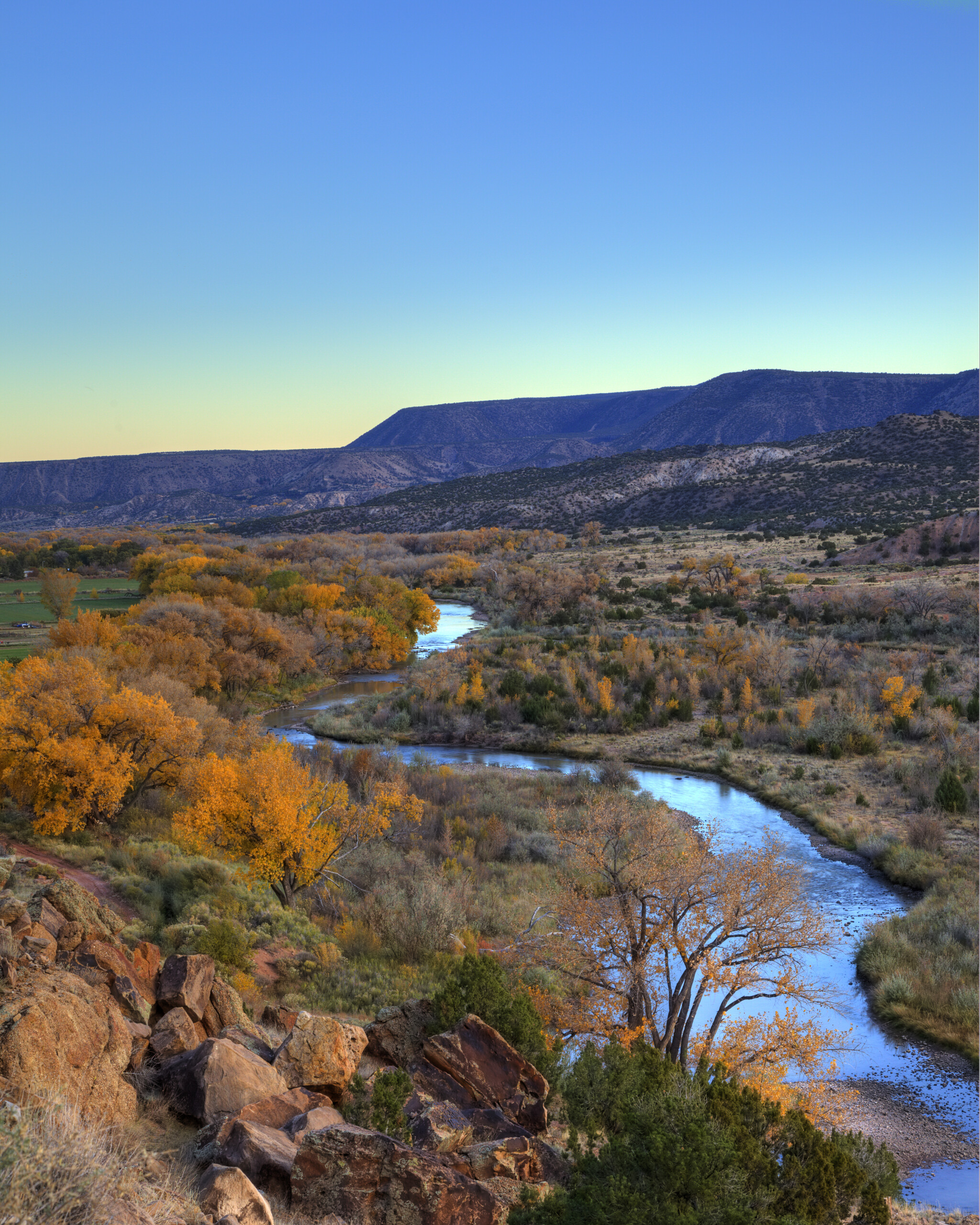 NM_2012_1024_ChamaRiver_GhostRanch_SS64262533 The Chama River in New Mexico winding through a fall landscape at dusk.