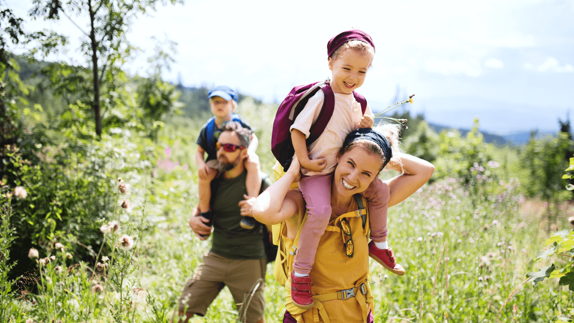 Family with small children hiking outdoors