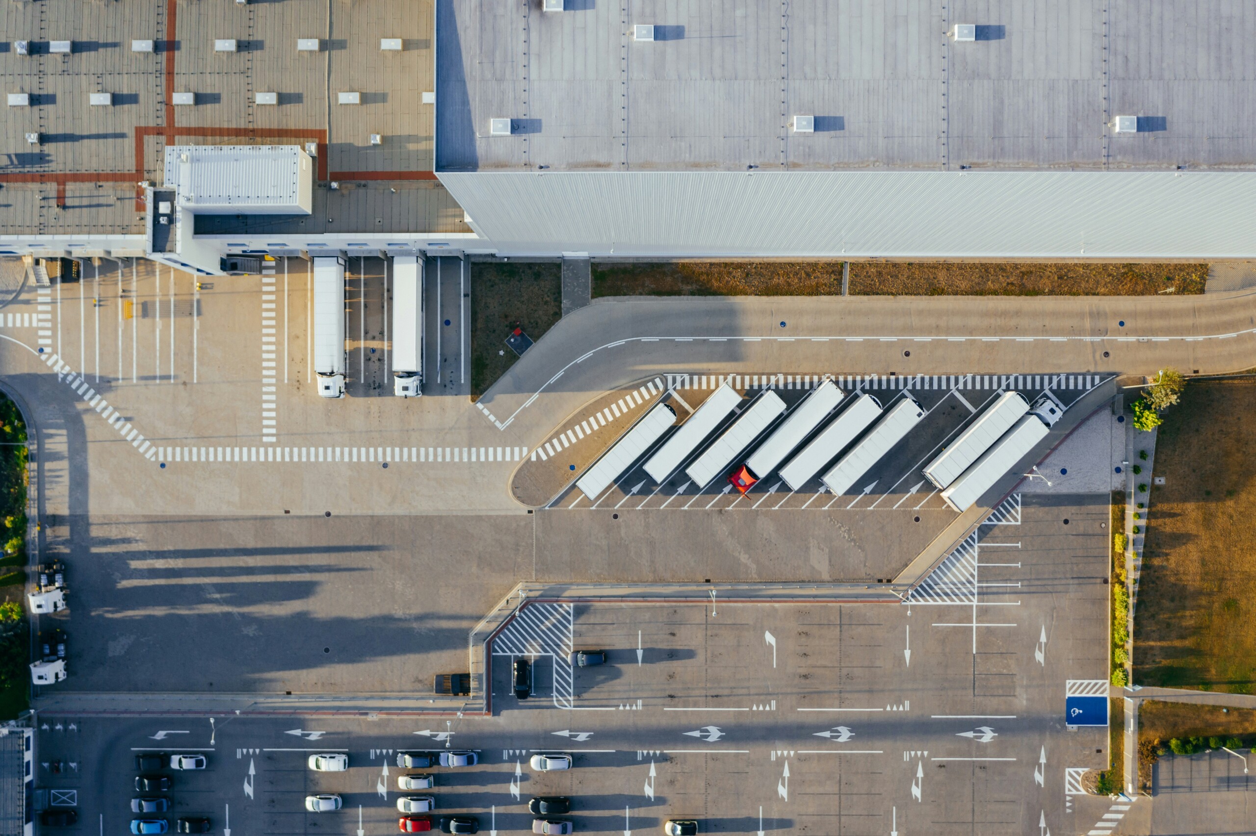 A warehouse and its trucks as seen from above.